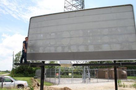 Justin proudly posing with our first billboard